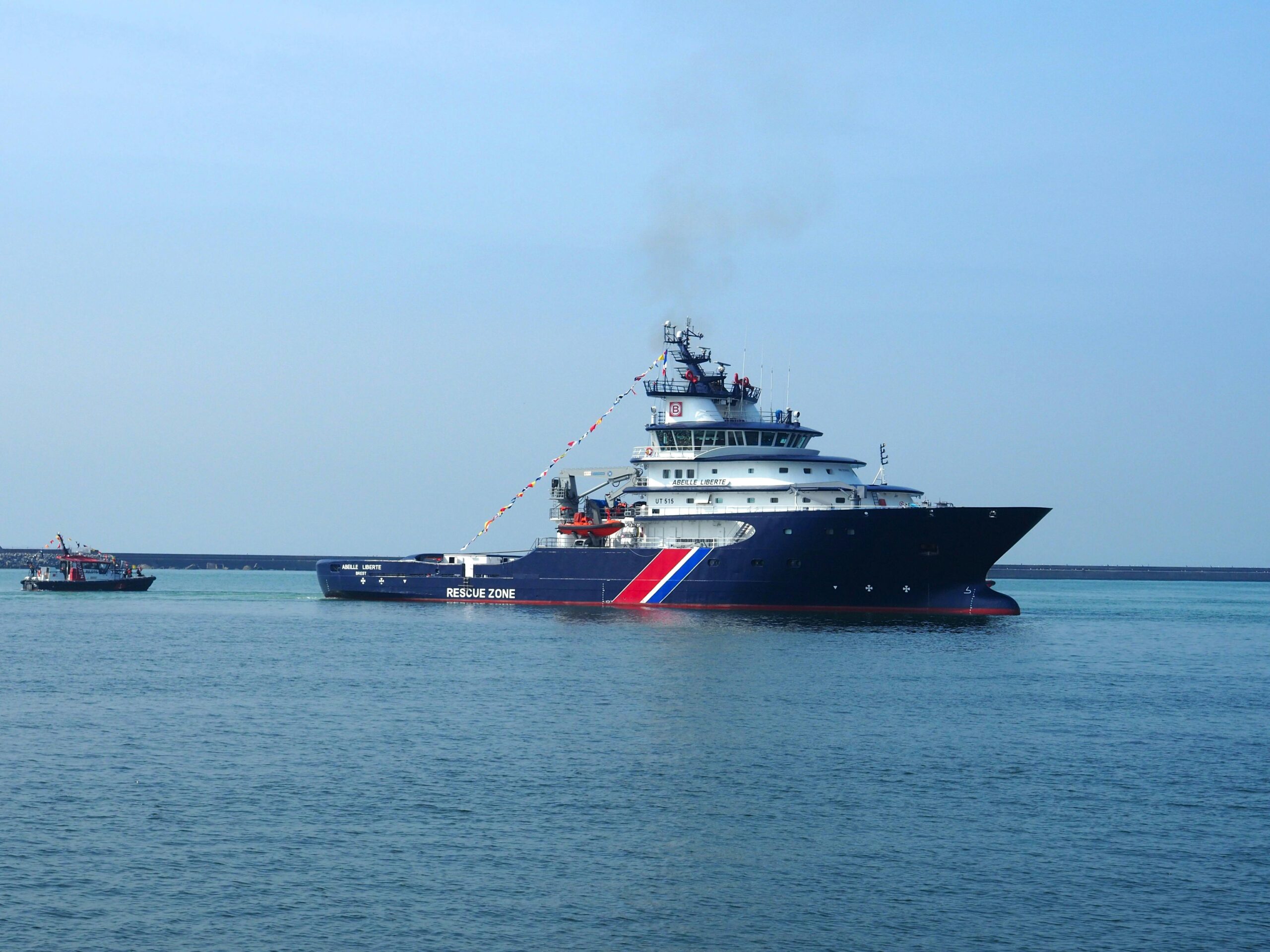 Rescue vessel navigating the waters off Le Havre, France on a clear day.